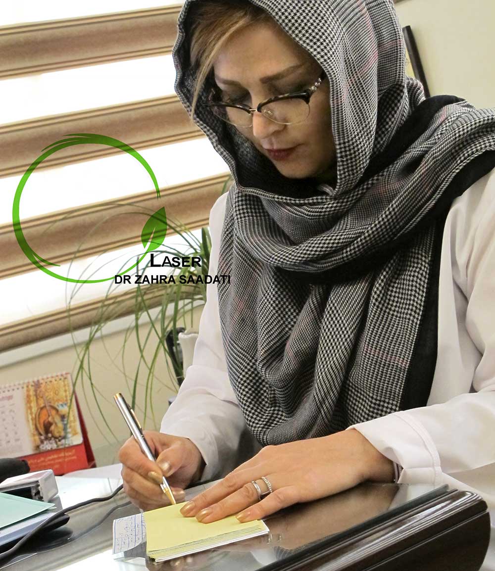 The picture of Dr. Zahra Saadati writing prescription for hemorrhoid treatment